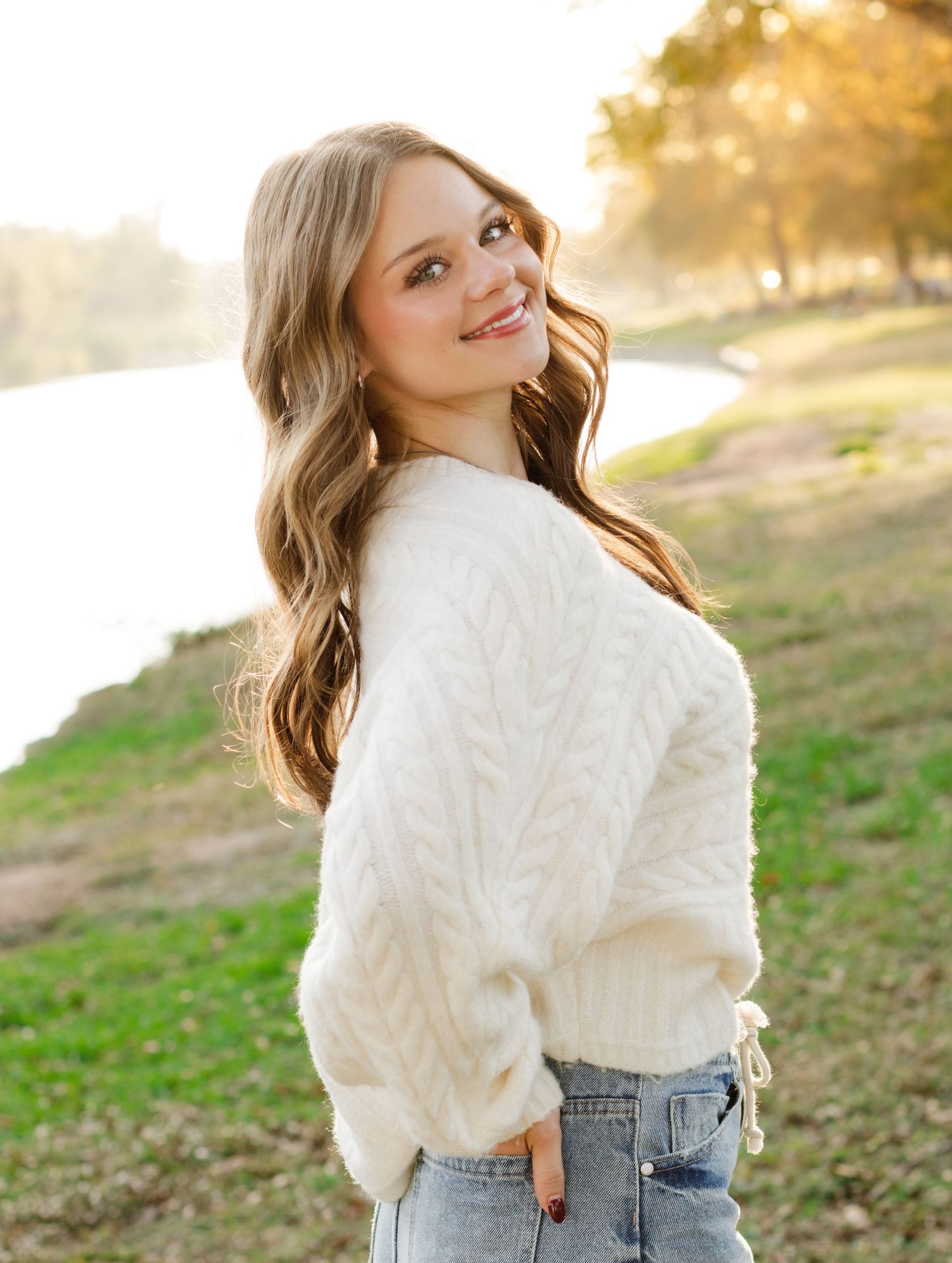 A girl smiles during a family photo shoot at San Gabriel Park in Georgetown, Texas.