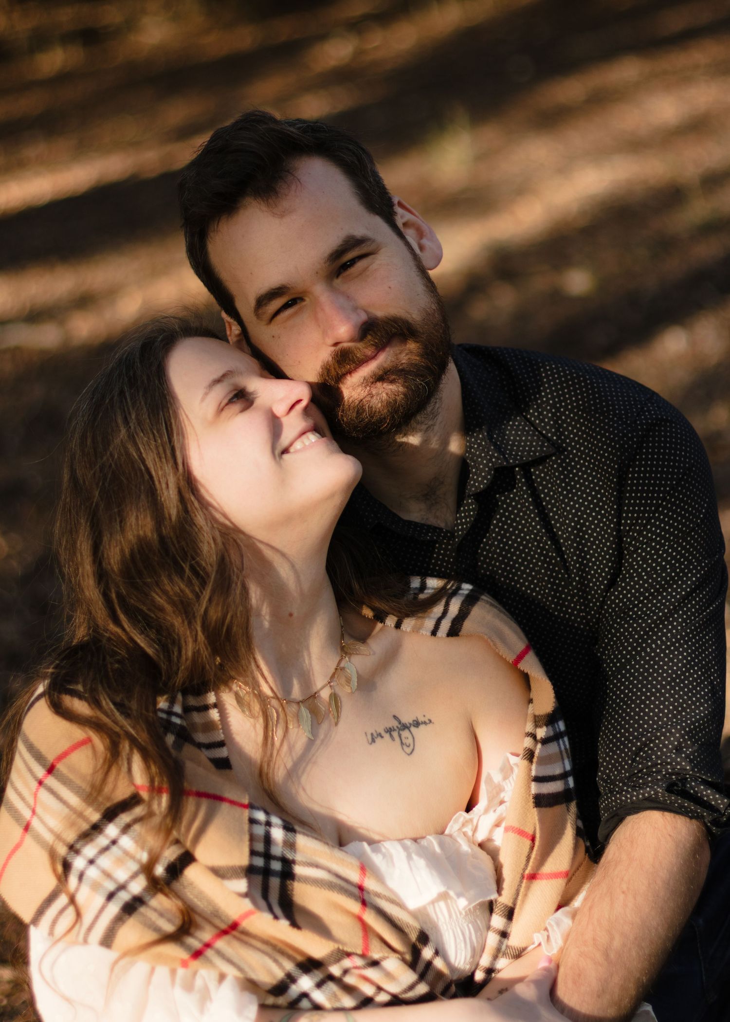 A couple looks at each other lovingly at a park near Austin, Texas.