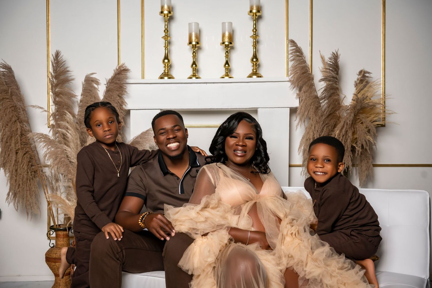 A group of people laughing and having fun while posing together in a cozy indoor setting with neutral decor.