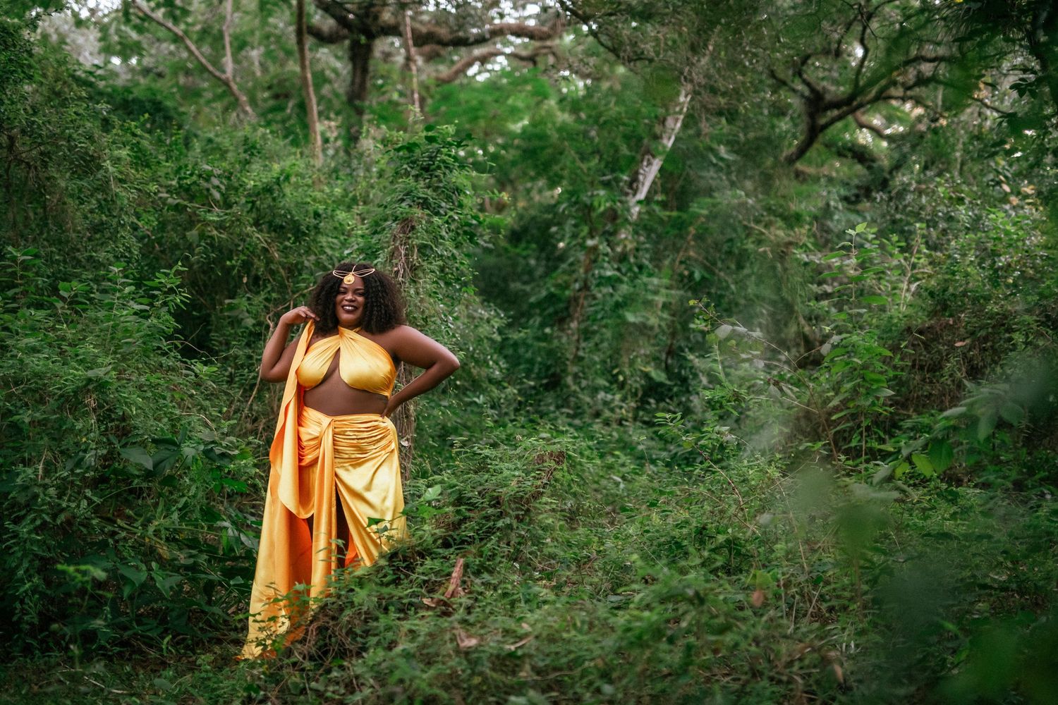 A series of seven connected images showing someone in a yellow dress walking through a lush green forest setting.
