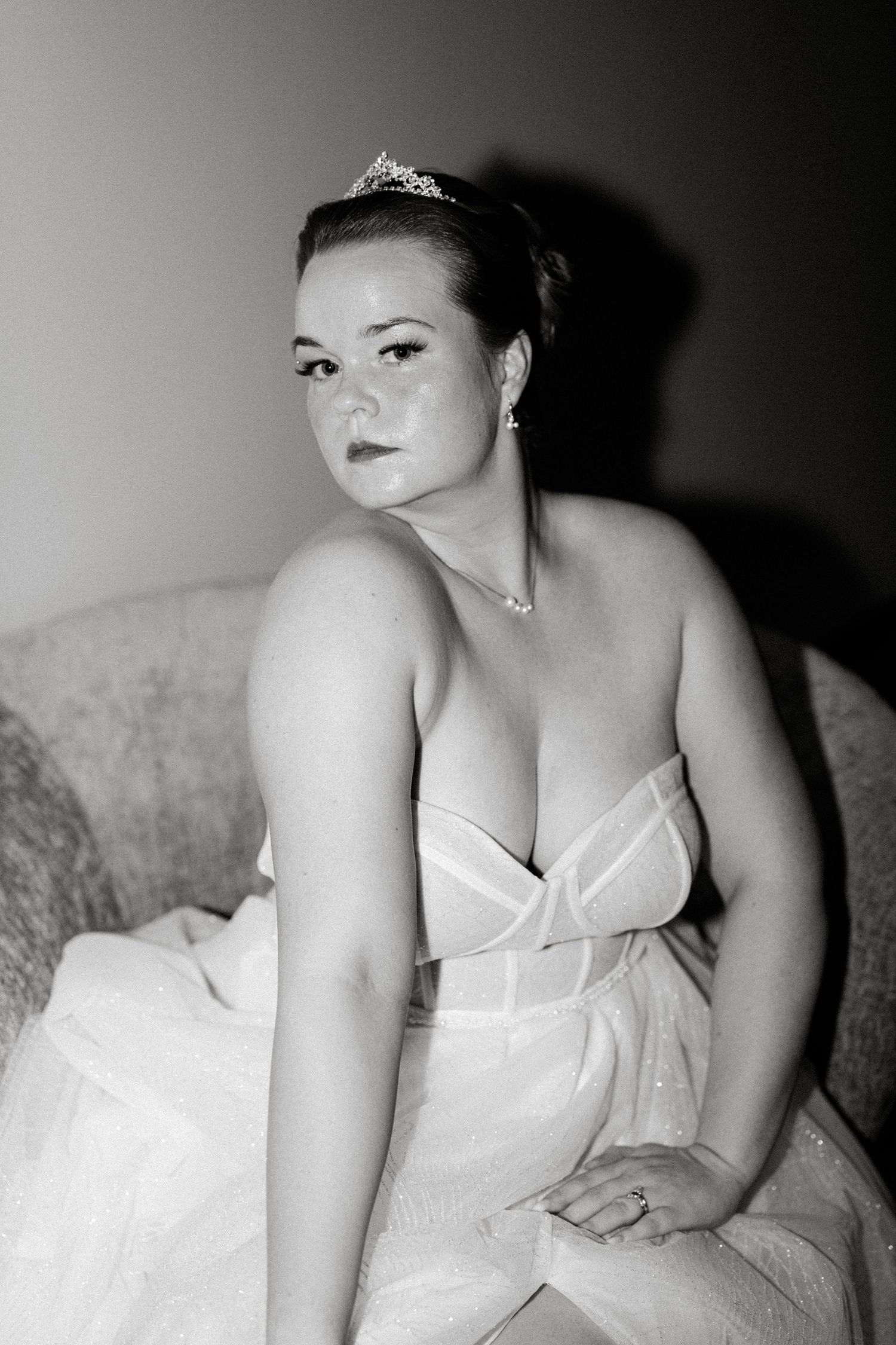 Artistic black and white bridal portraits showing details of a white wedding gown.