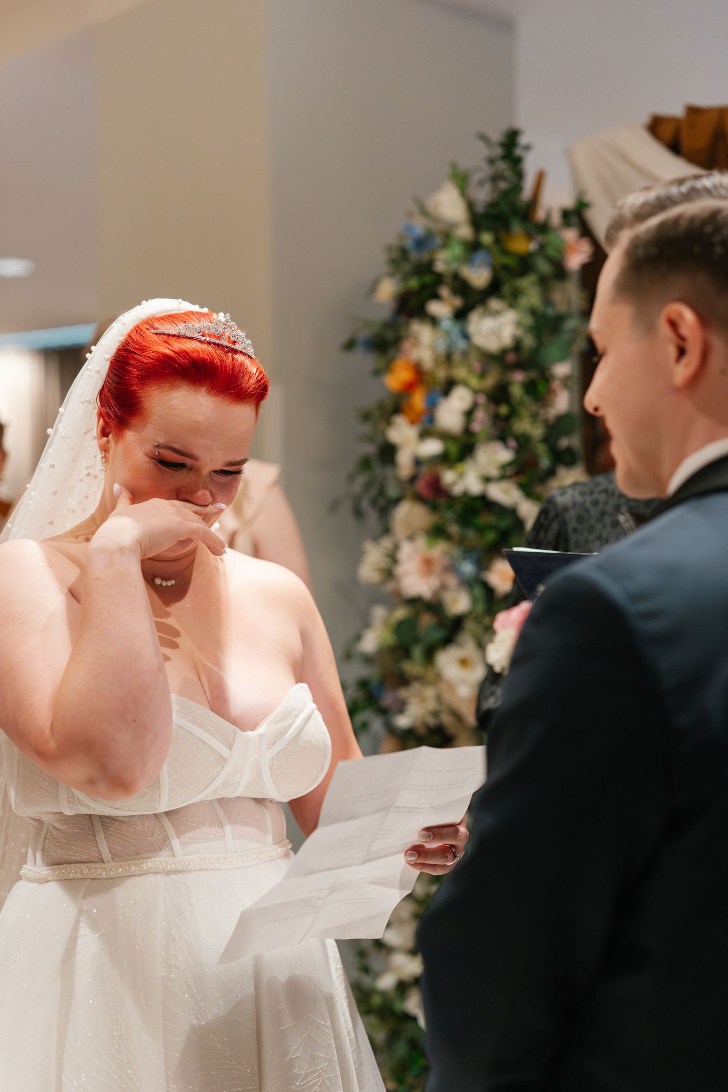 Candid wedding ceremony moment showing expressions of joy and emotion.
