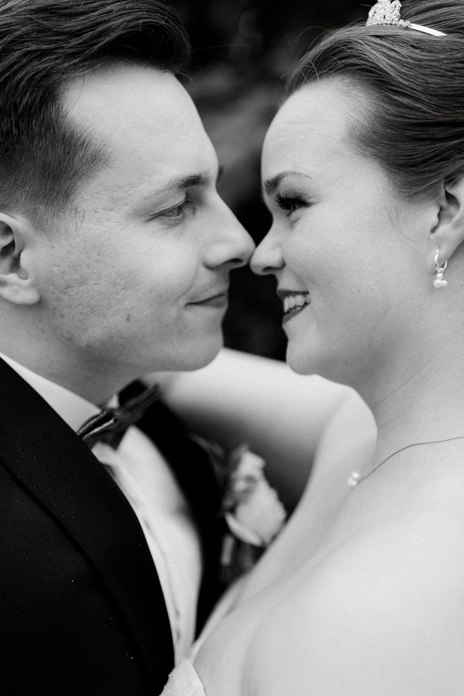 Black and white close-up of a romantic wedding day moment.