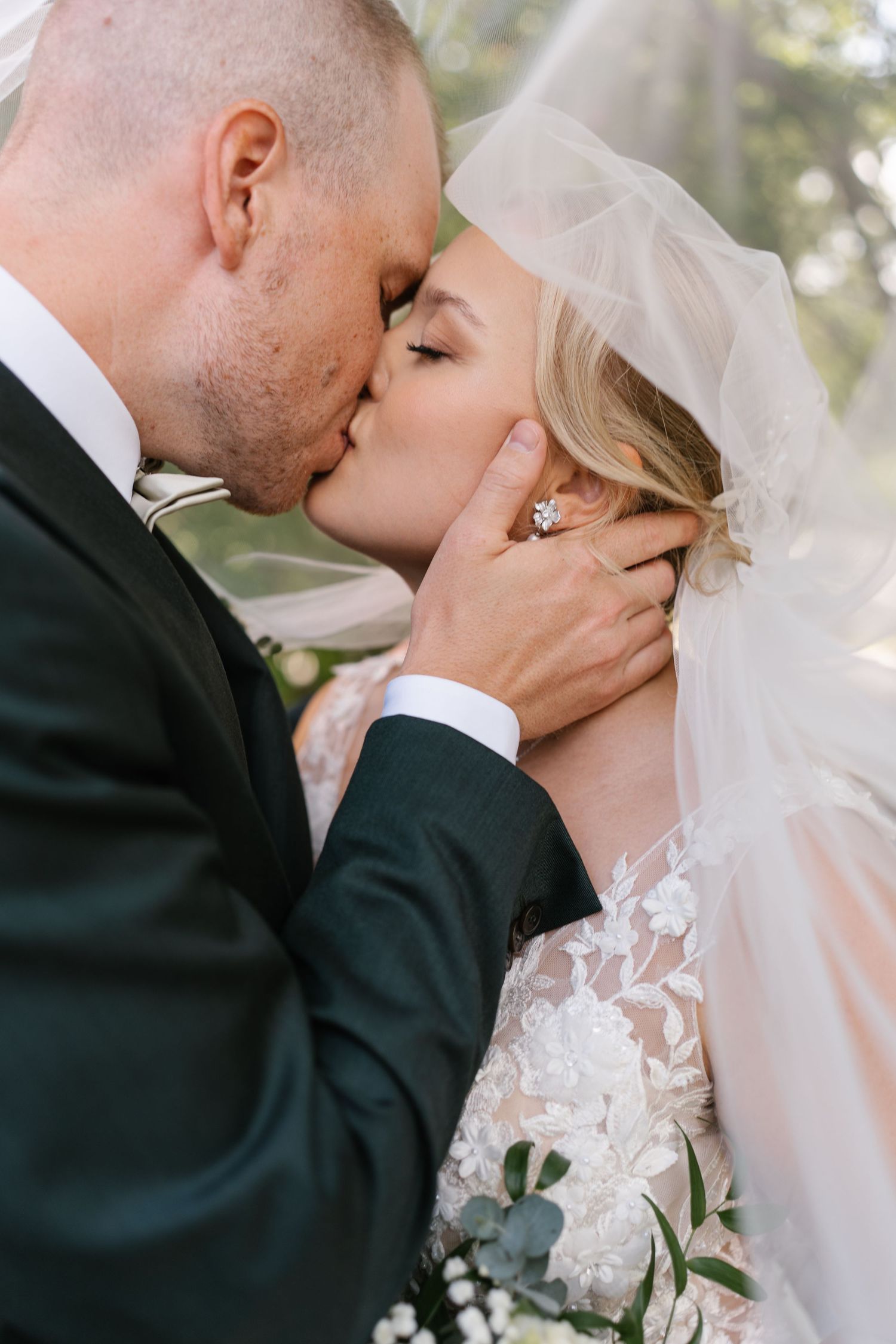 Tender wedding kiss captured in a series of intimate close-up photographs with delicate lace details.