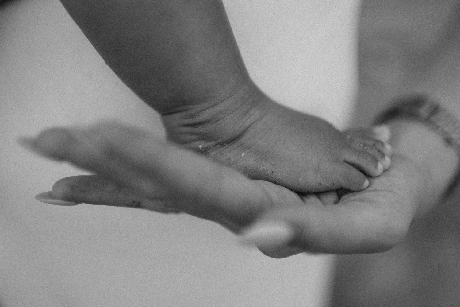 a baby's foot placed on her mother's palm, photo session in Kent, UK
