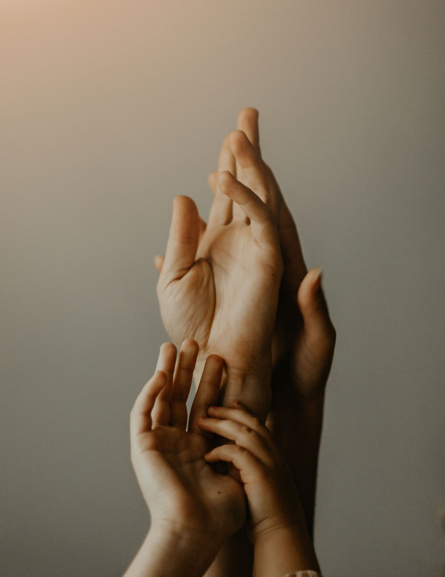a close-up of a family's hands