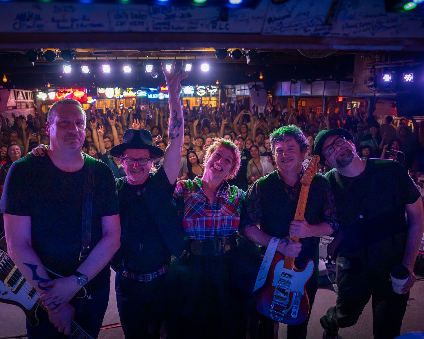 Sixpence None the Richer posing on stage with the crowd after a live performance at Gruene Hall in Texas.
