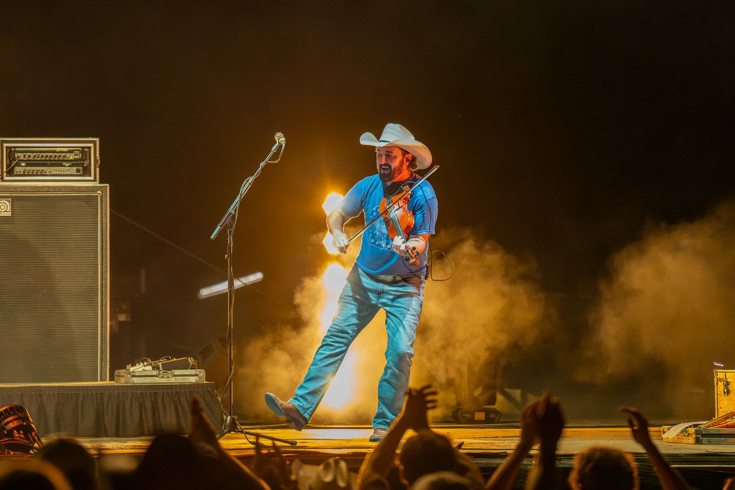 Brady Black with Randy Rogers Band performing live at Round Rock Amphitheater, photographed under dramatic stage lighting and concert haze.