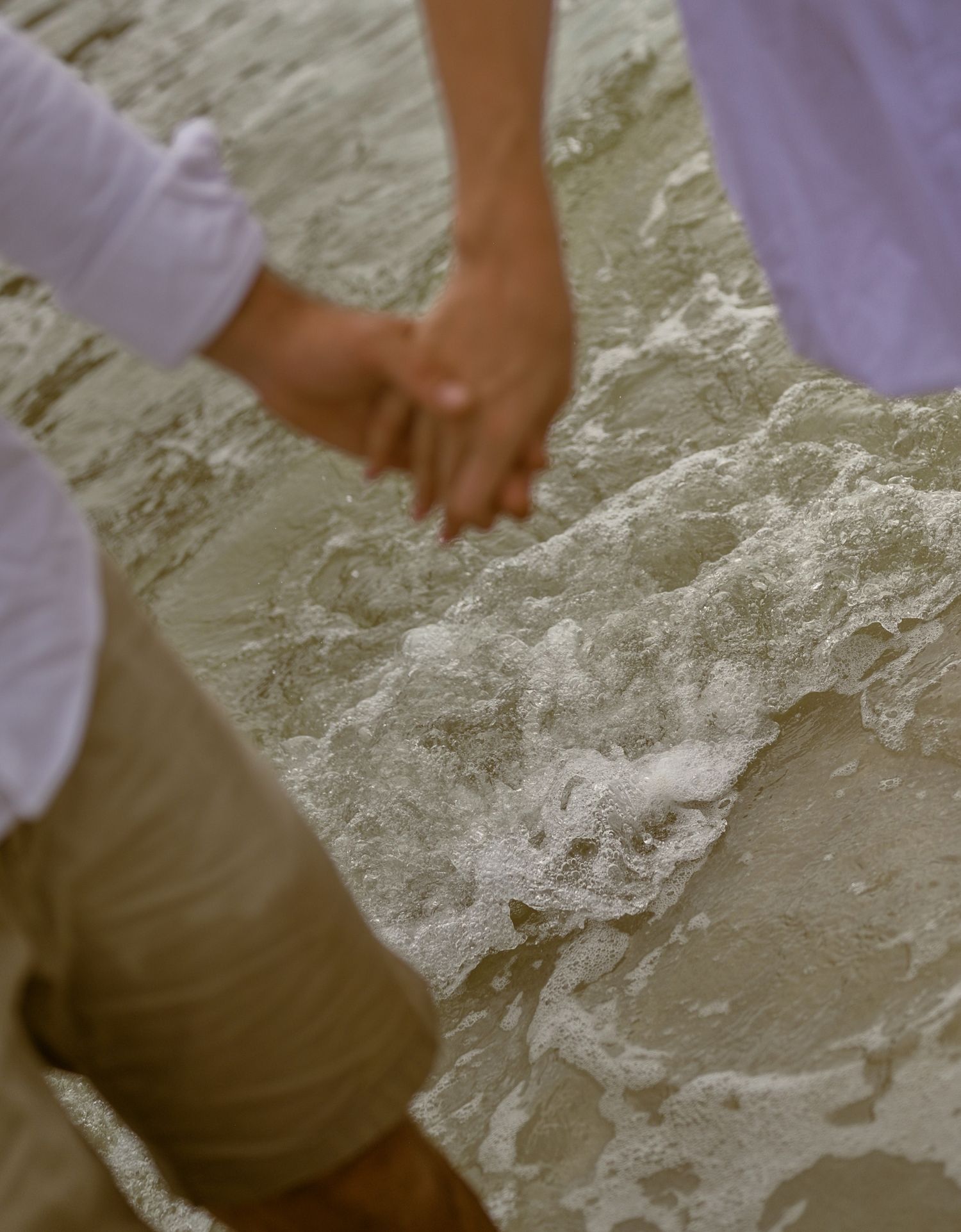 Couple holding hands during a wedding session in St. Augustine, Florida