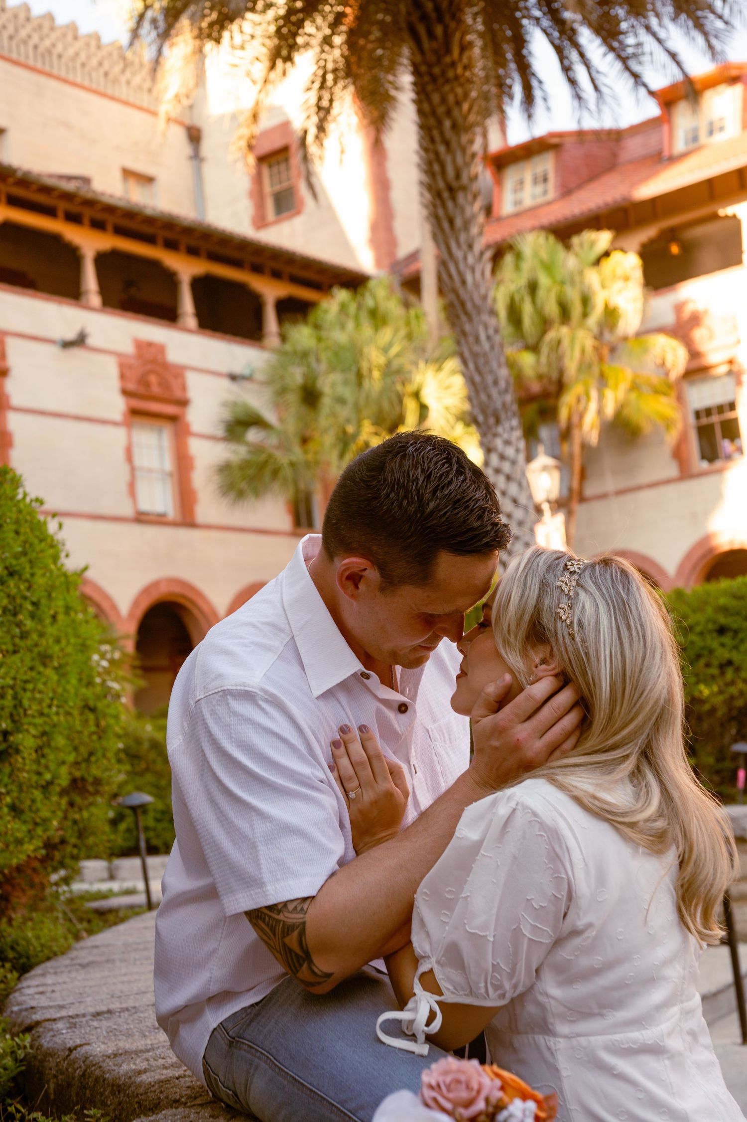 Couple kissing during a romantic engagement session in St. Augustine, Florida