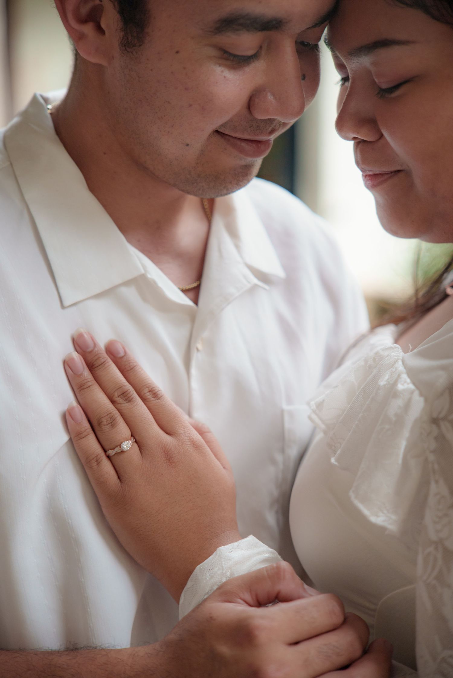 Close-up of a wedding couple sharing a quiet moment together