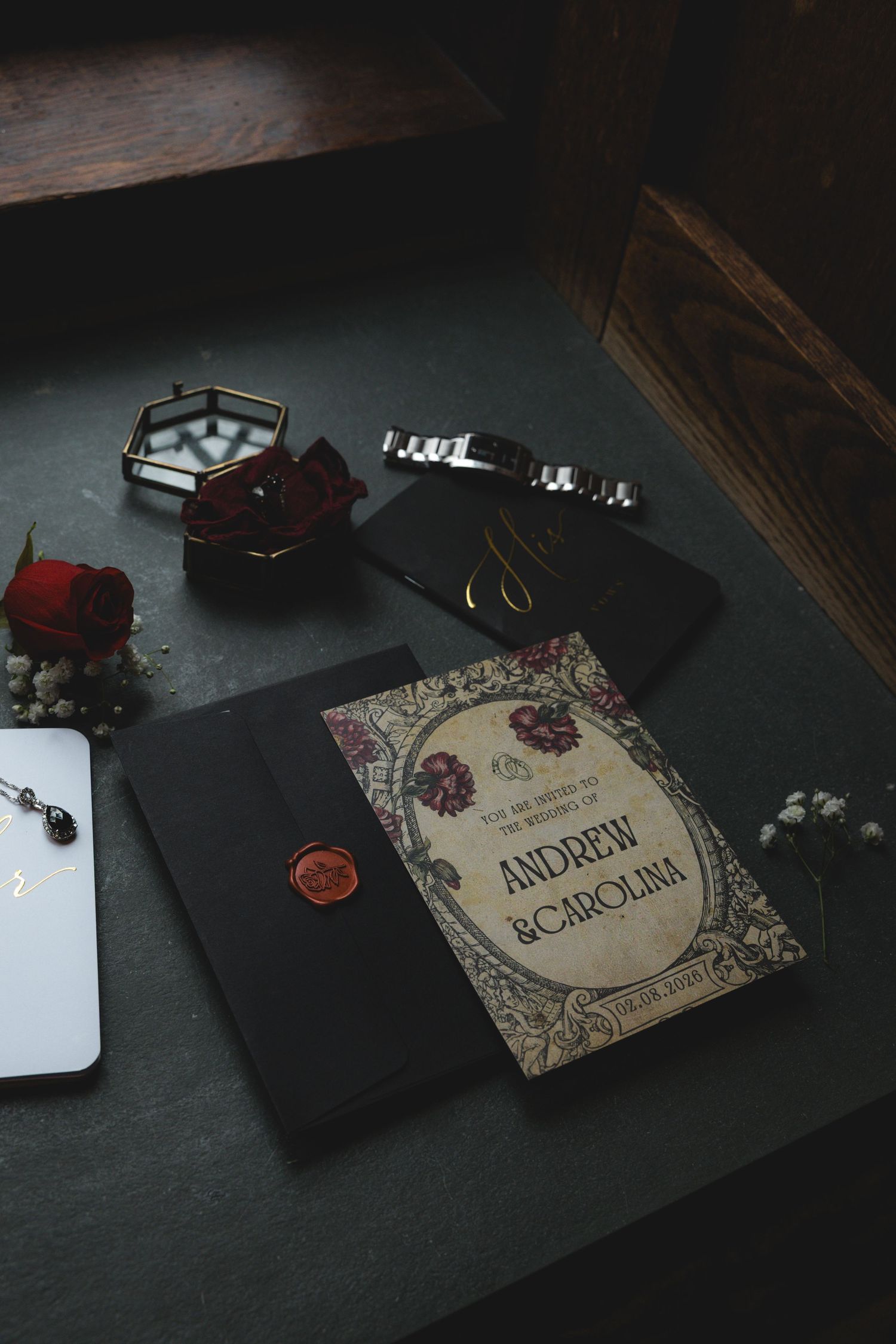 A book titled 'Andrew Borodin' is displayed on a table along with various personal items.