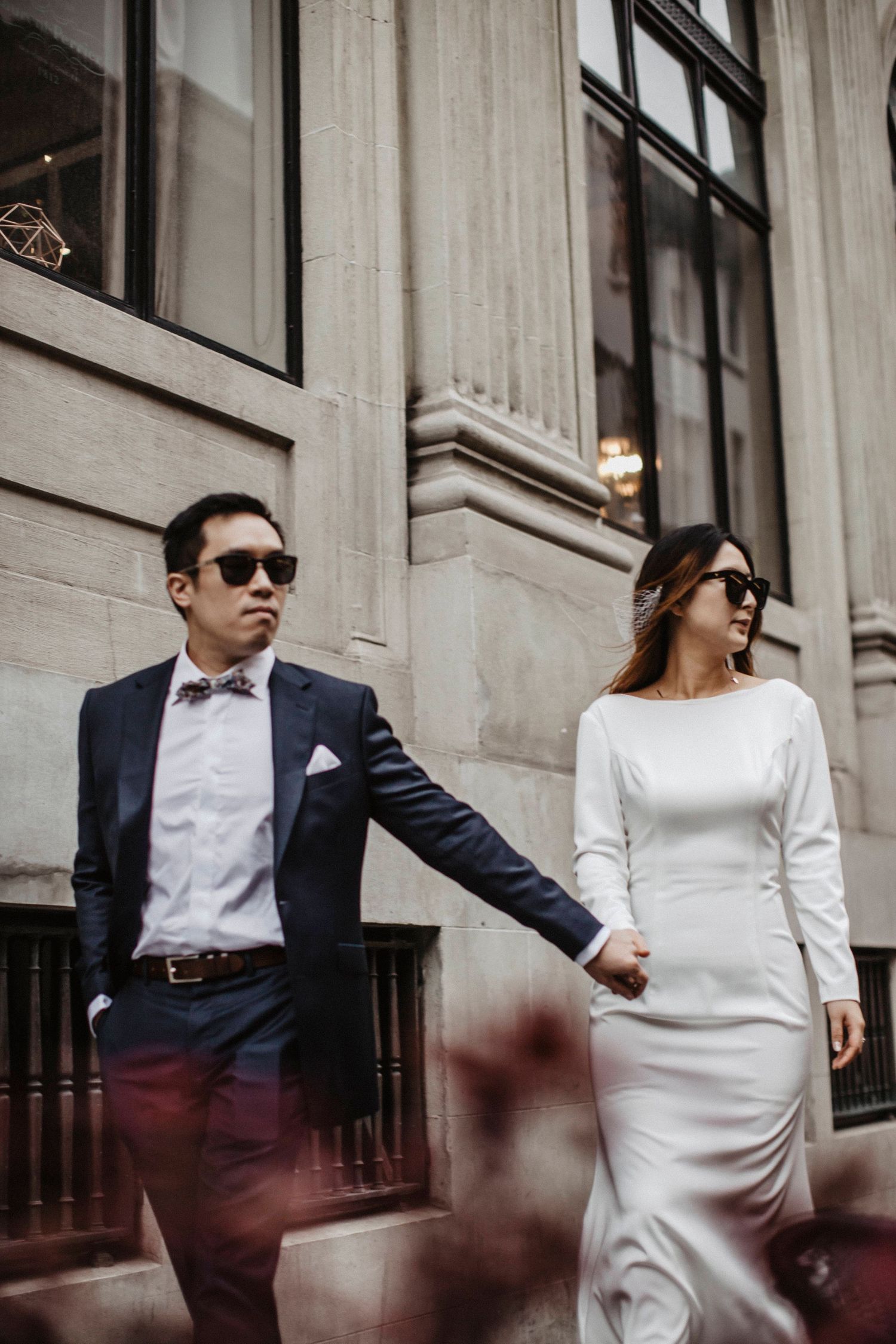 Siblings holding hands walking together, Auckland family photography