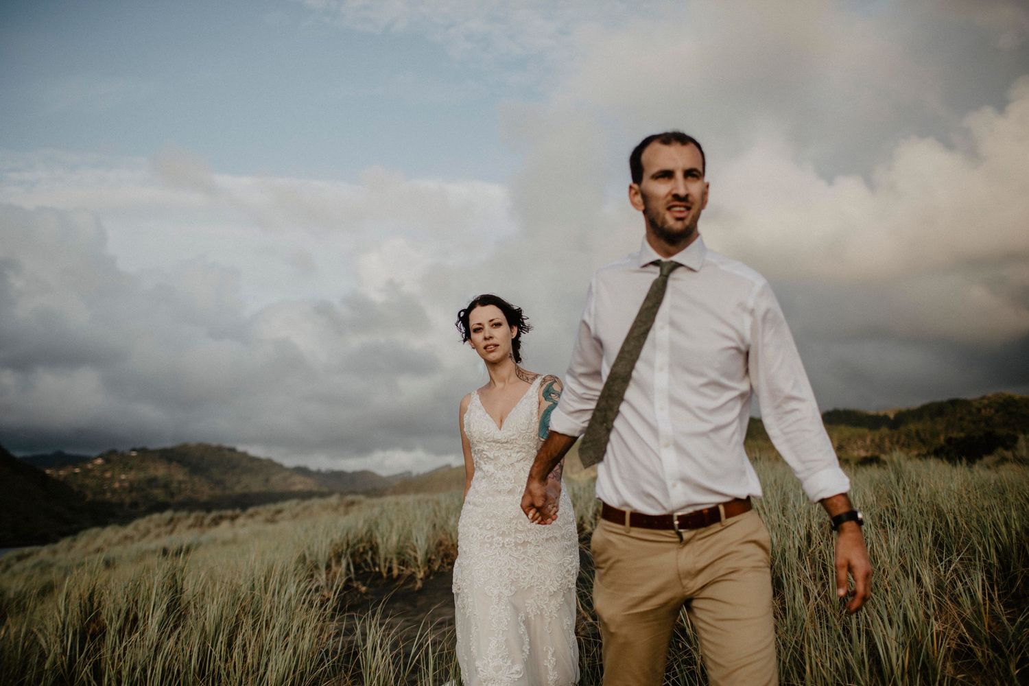 Bride and groom holding hands during their first look