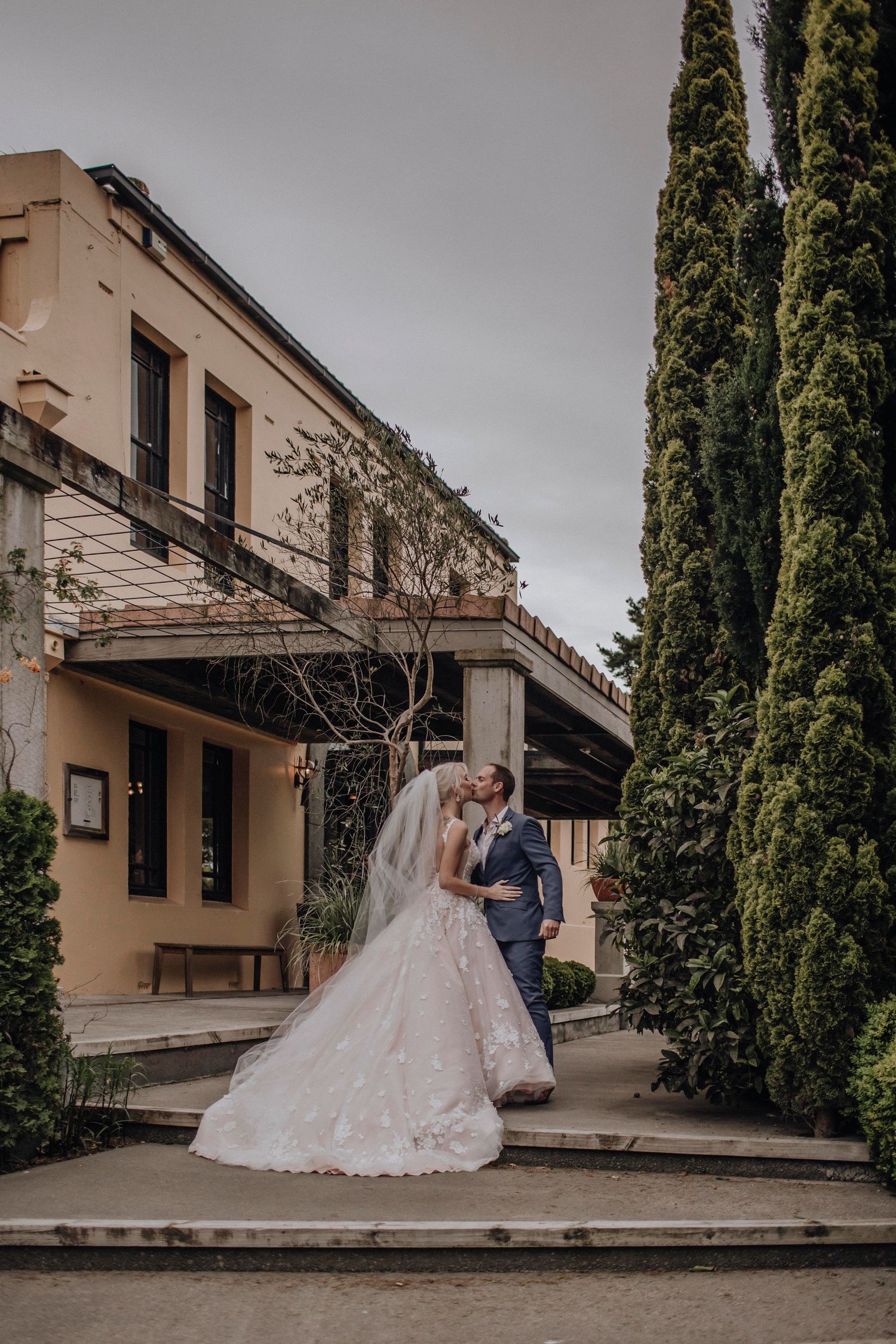 Couple recreating an old photo during anniversary shoot