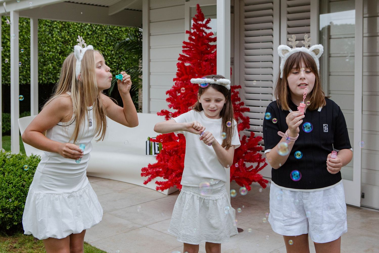 Twins holding hands during family photo session