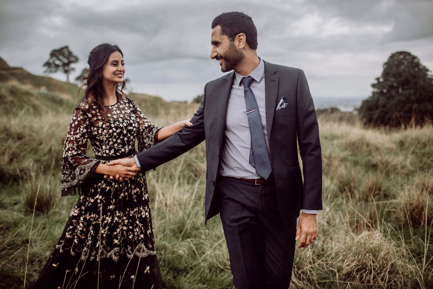 Couple laughing together during golden hour session