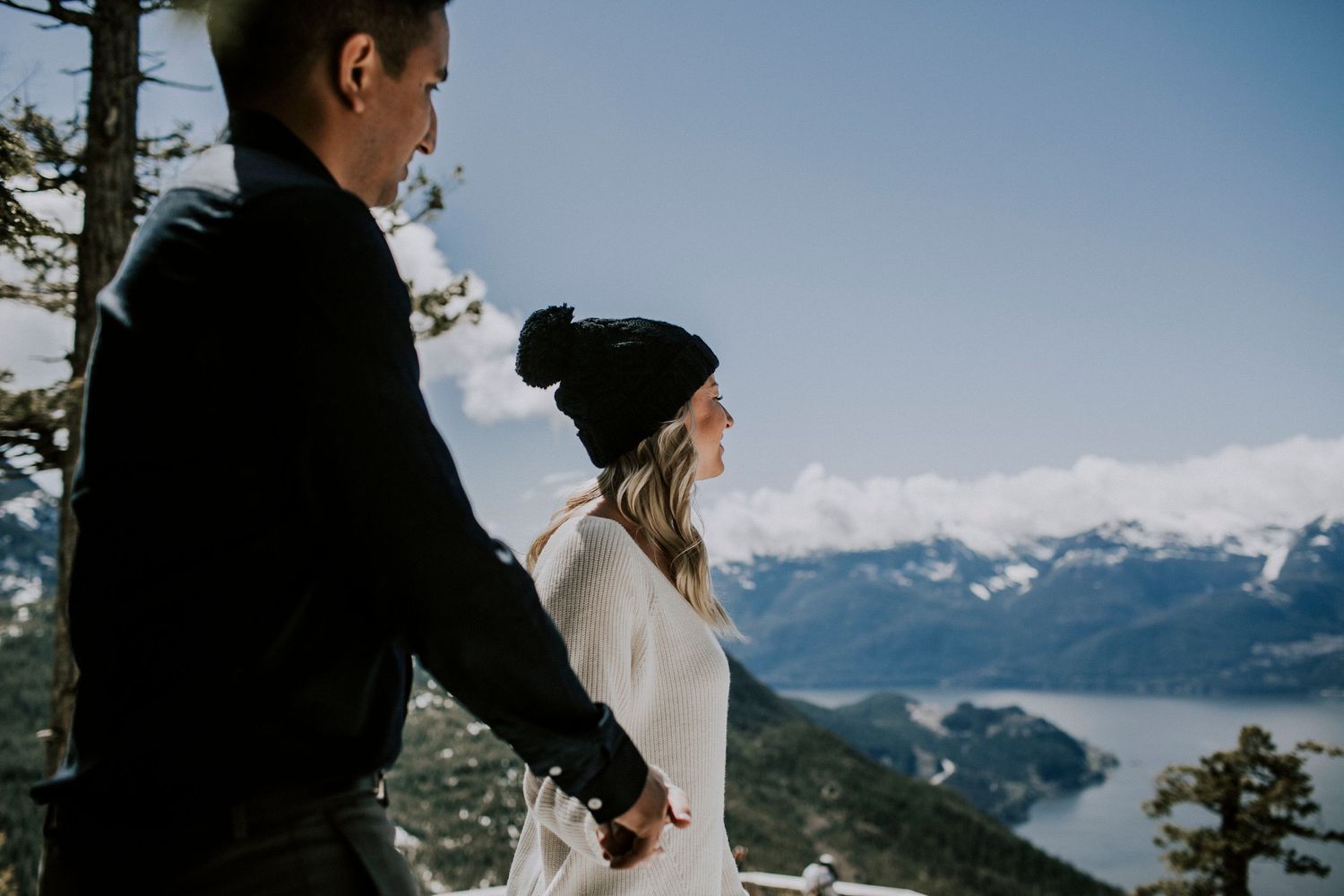 Couple walking hand in hand during engagement session