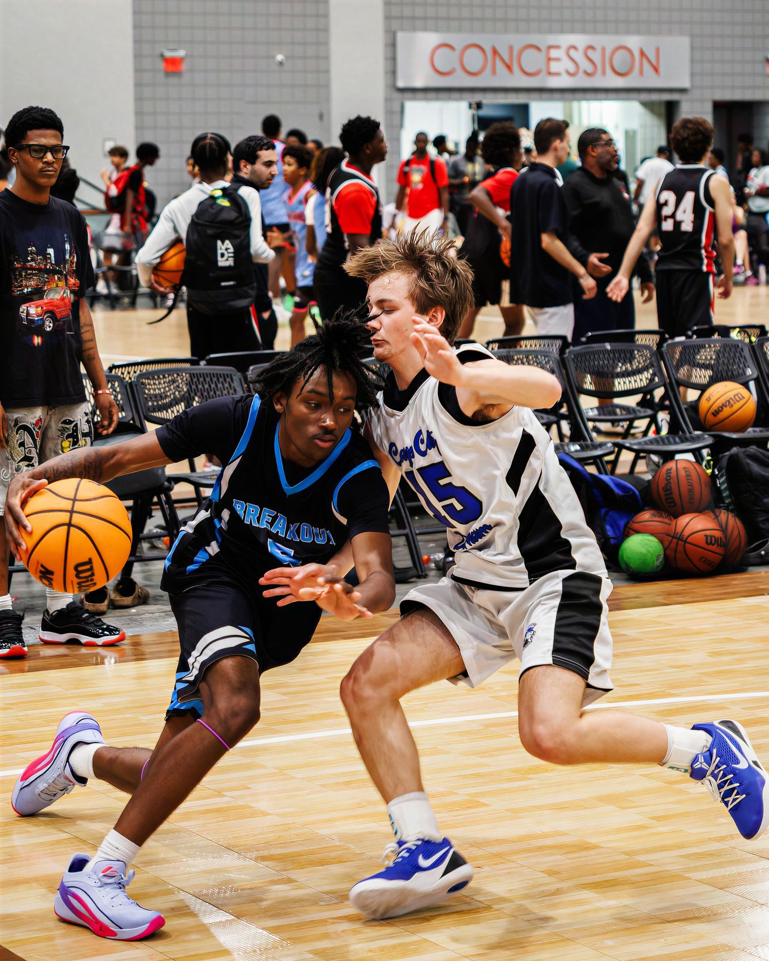 teenage basketball player driving towards the hoop