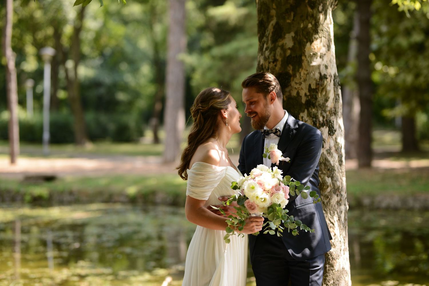 Bride and groom sharing an intimate moment outdoors, romantic wedding photography by Herzenshaus Studio, Frankfurt Rhein-Main.