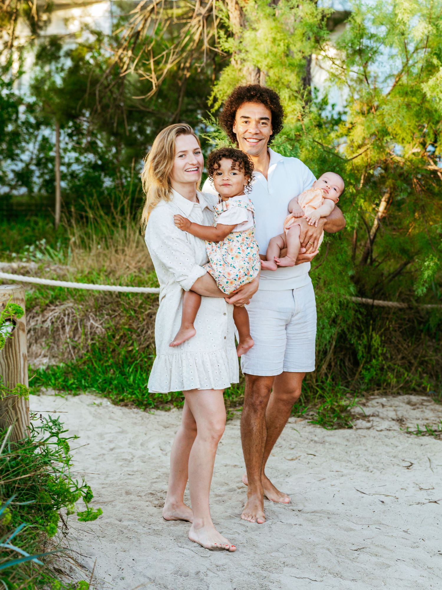 Twp little lives, held in the arms of the place they will always know first as home - family. Family photography by Herzenshaus Studio.