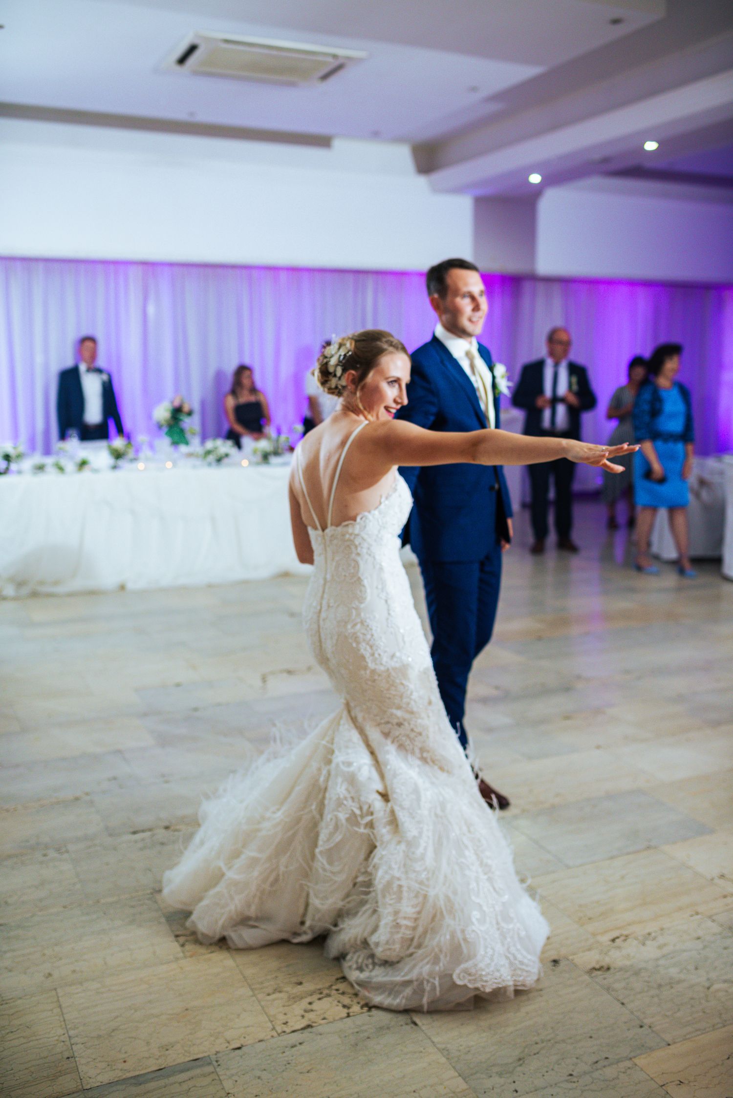 Bride and groom sharing their elegant first dance at a wedding reception.