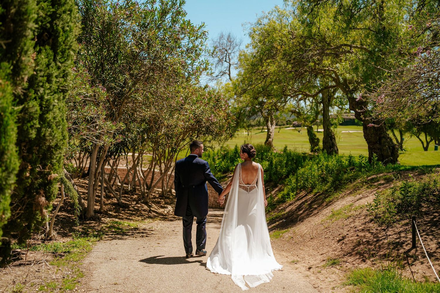 Bride and groom walking hand in hand into their next chapter - a timeless wedding photograph by Herzenshaus Studio, Frankfurt Rhein-Main.
