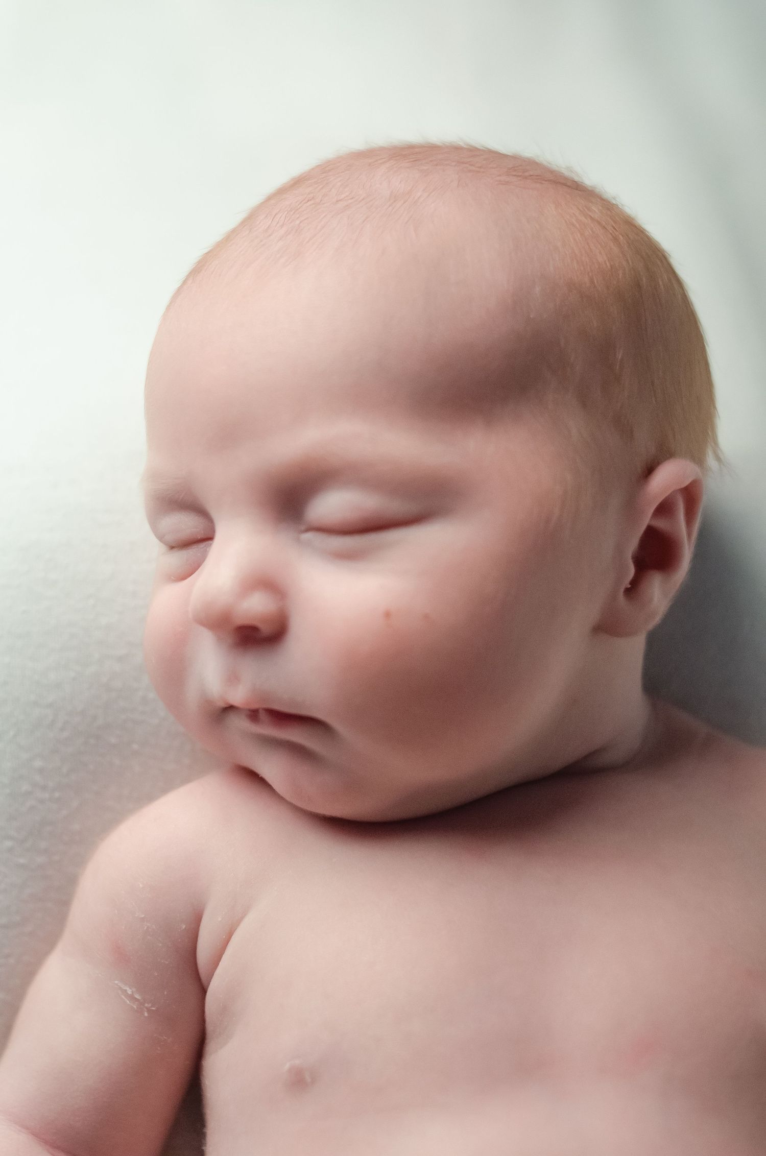 close up professional micro detail shot of newborn boy sleeping in home studio in east texas