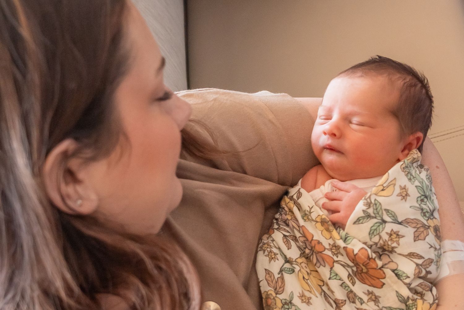 Mom holding her newborn during a baby-led studio session in home studio in Tyler texas