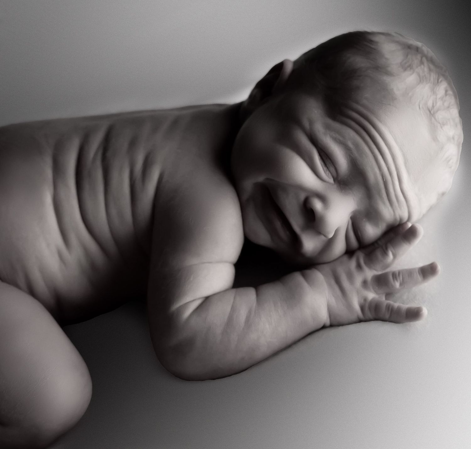 black and white image of newborn in home photography studio in henderson texas