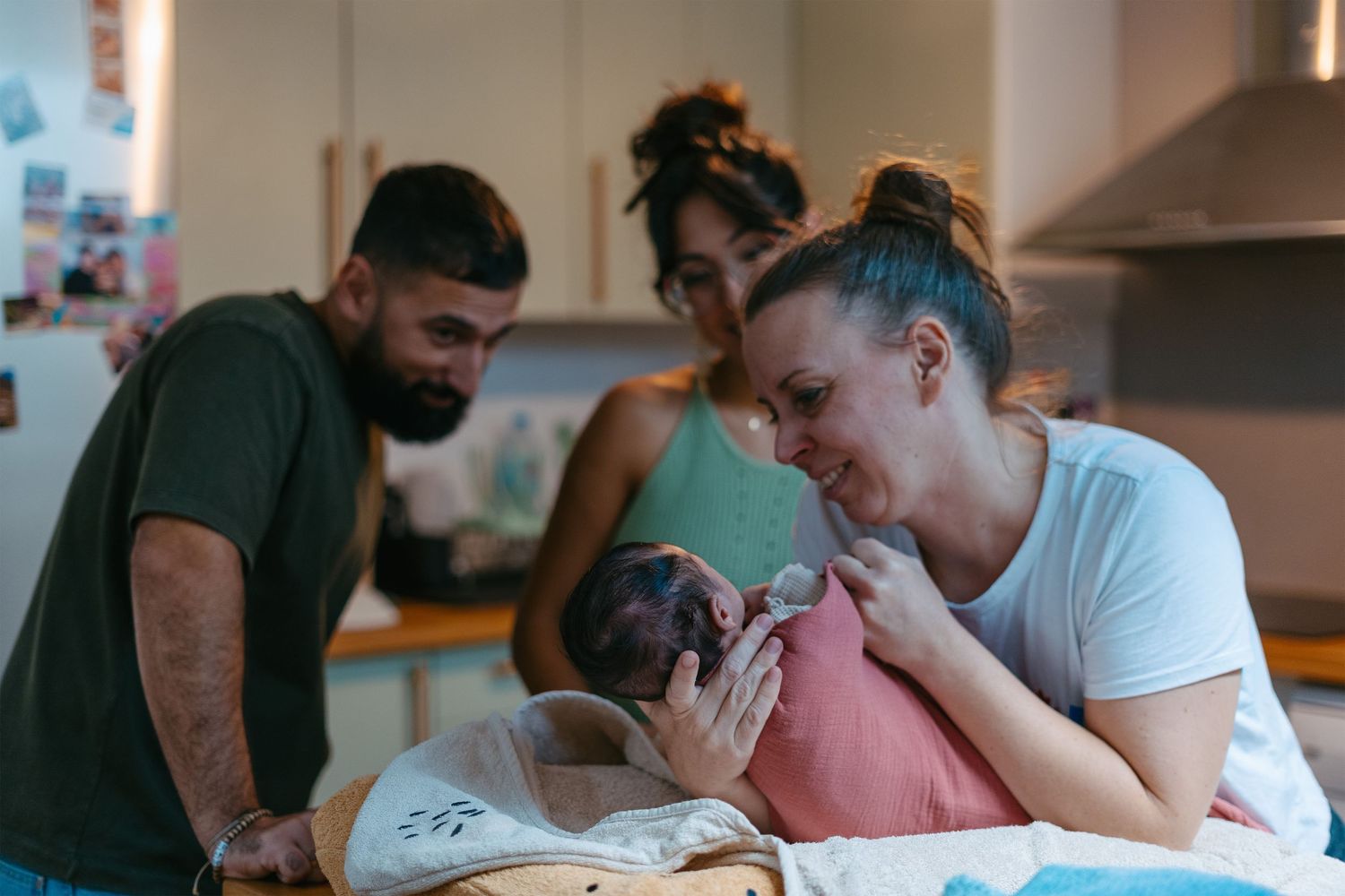 Parents bathing their baby