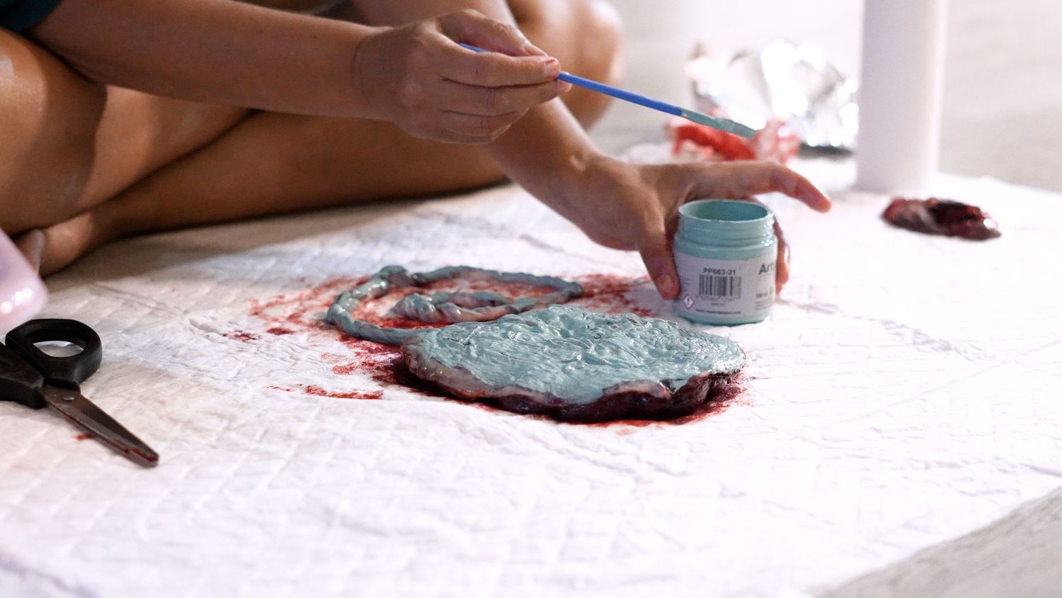 Woman painting a placenta