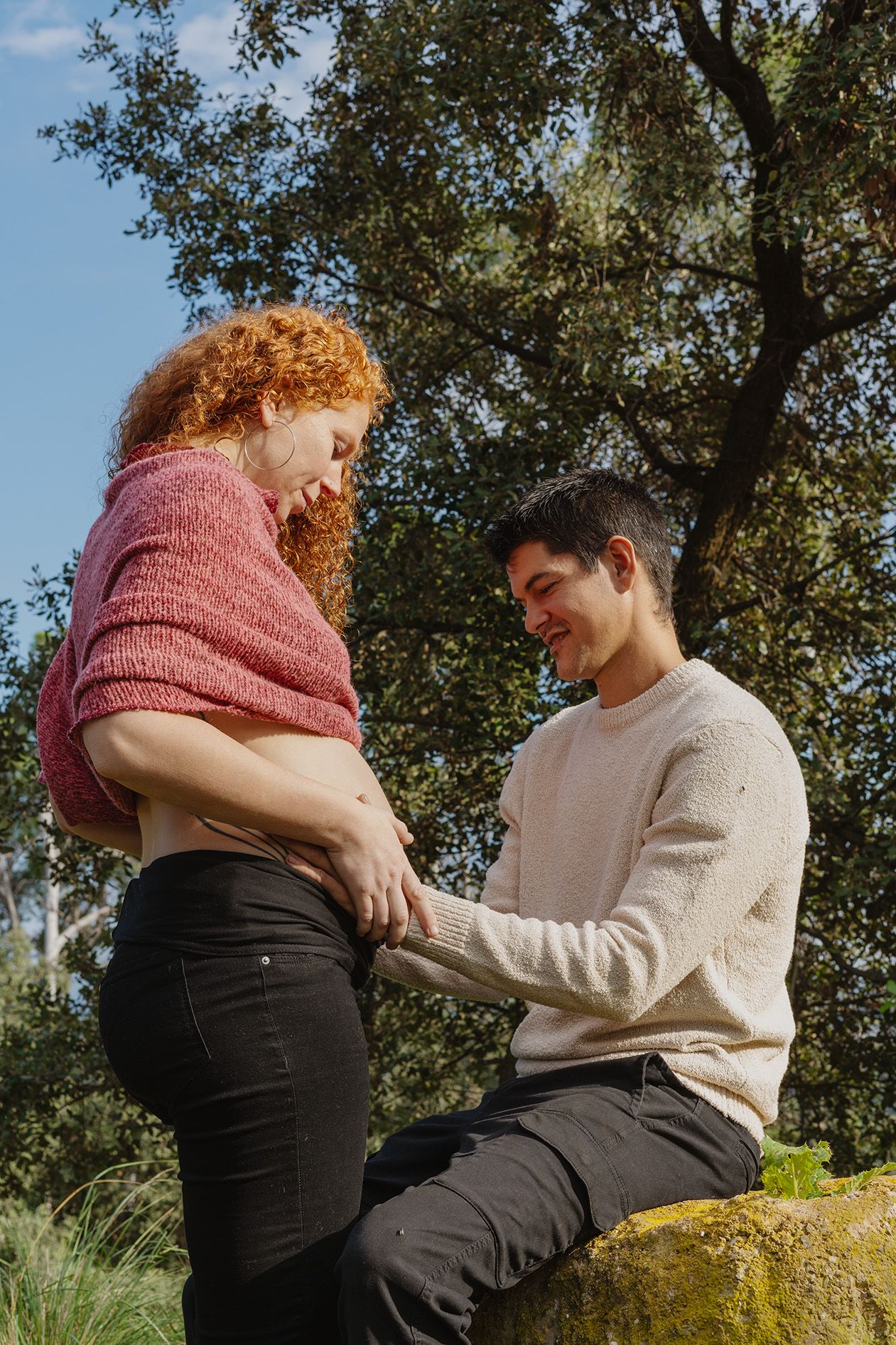 Couple hugging, the woman is pregnant