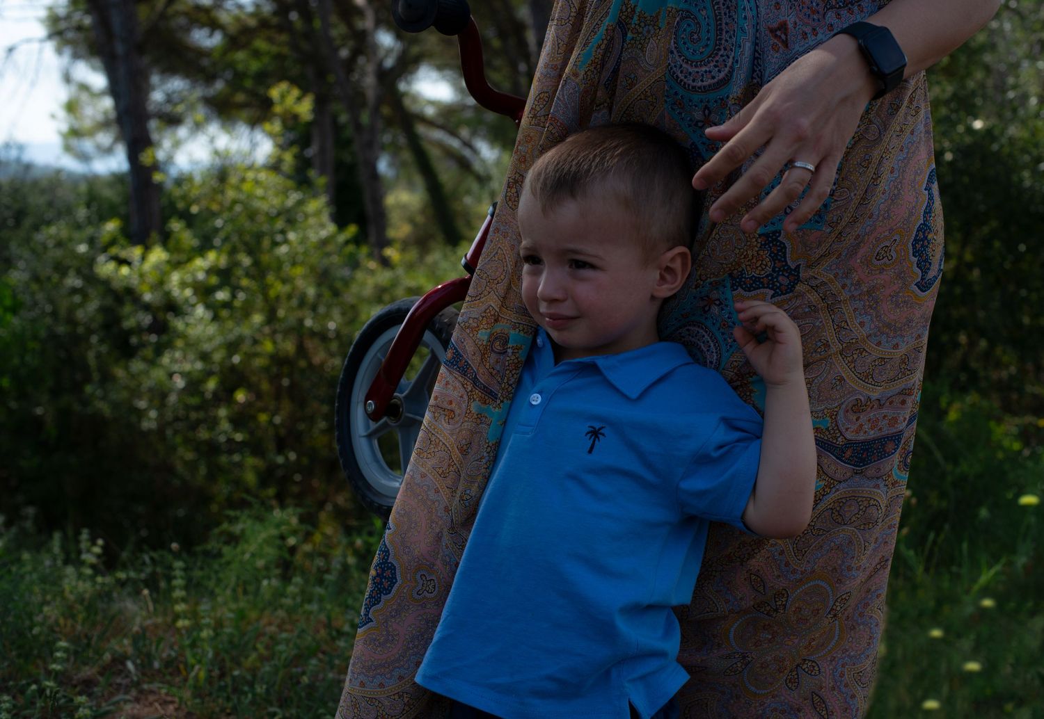 Little boy and his mom in the woods
