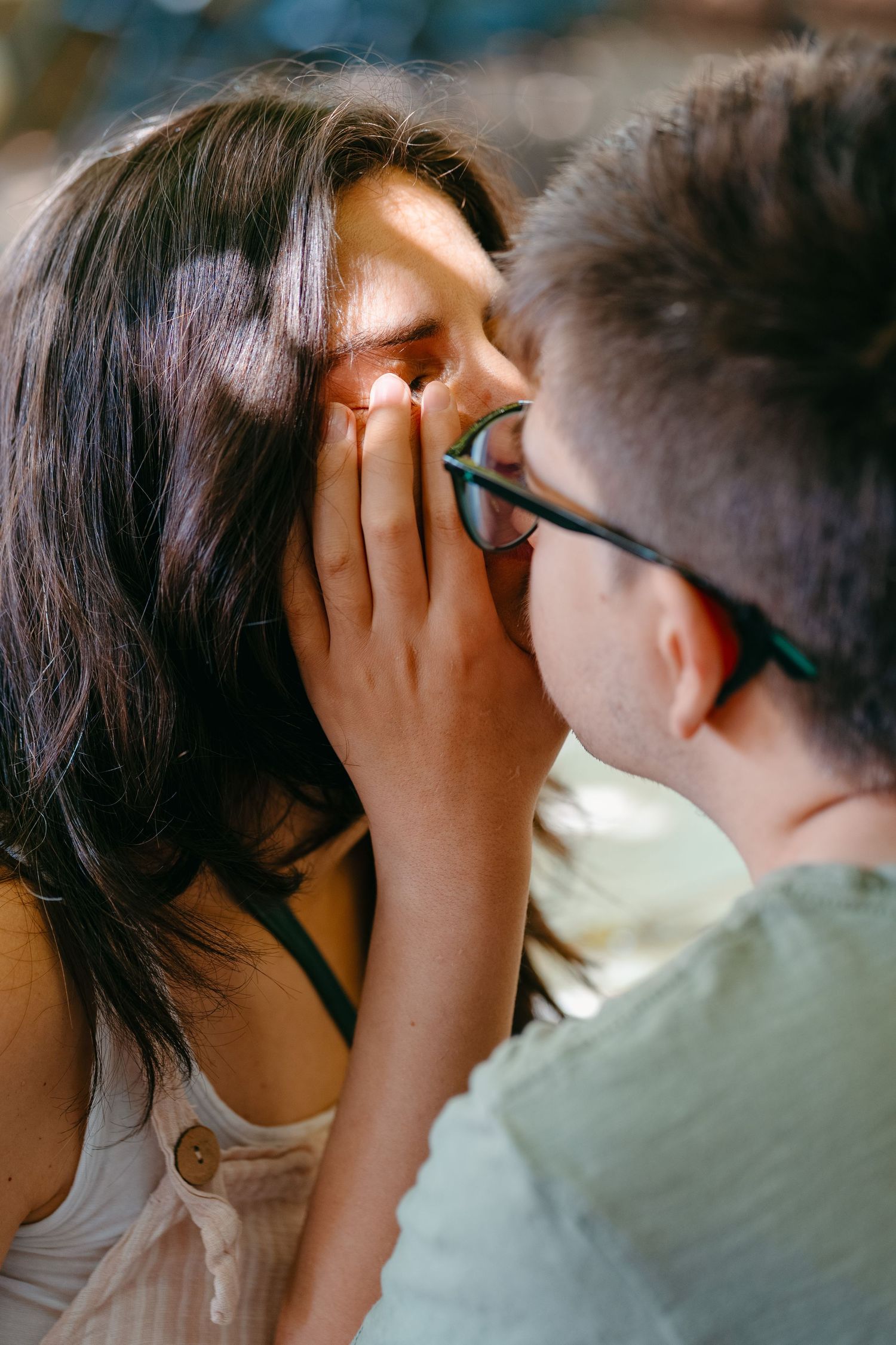 Boy kissing his mother