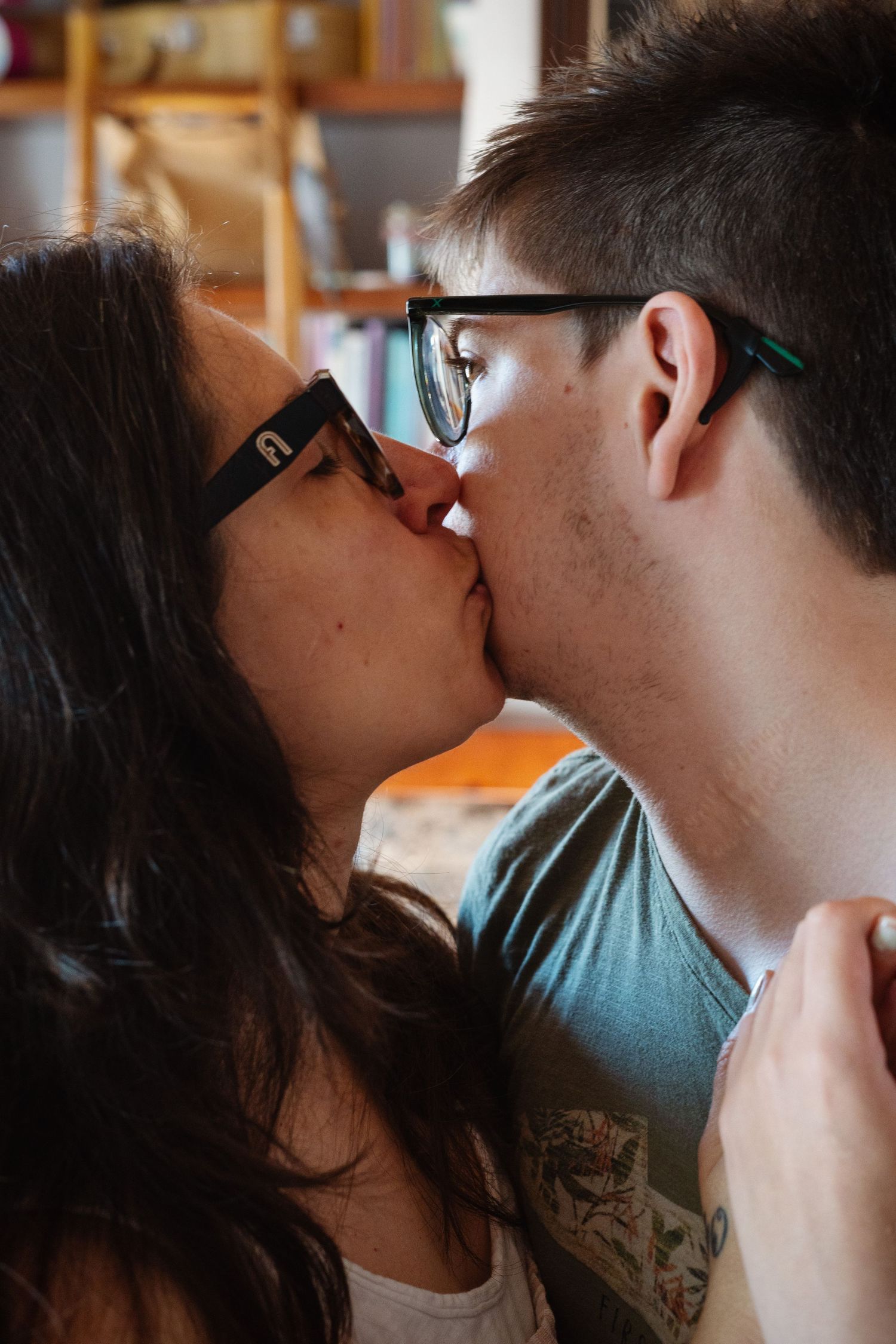 A mother kissing her son