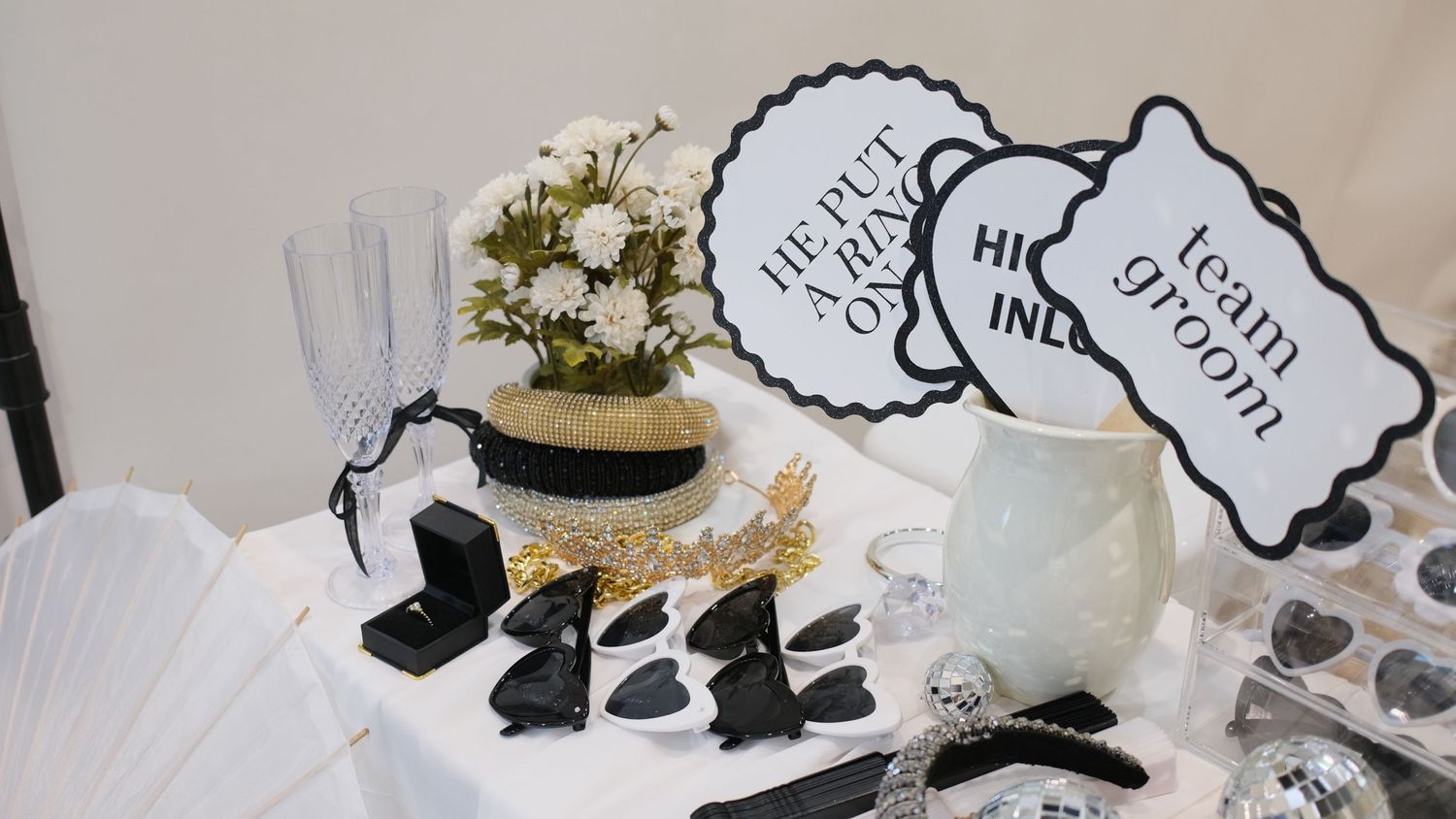 Photo booth props and decorations including speech bubbles, flowers and white fans. Perth WA Photo booth Hire Event Booth
