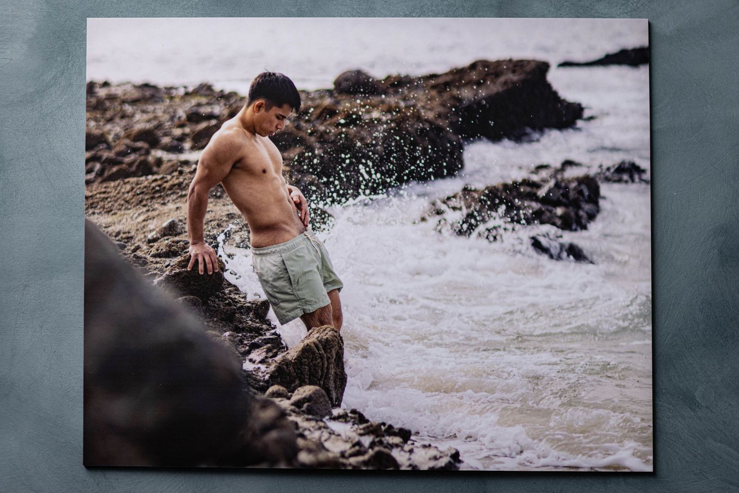 Photographic print of shirtless man at Southern California beach with Los Angeles boudoir photographer.