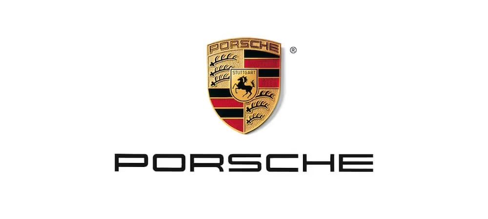 Porsche logo featuring the iconic black and gold crest shield emblem with the brand name in bold black letters below.