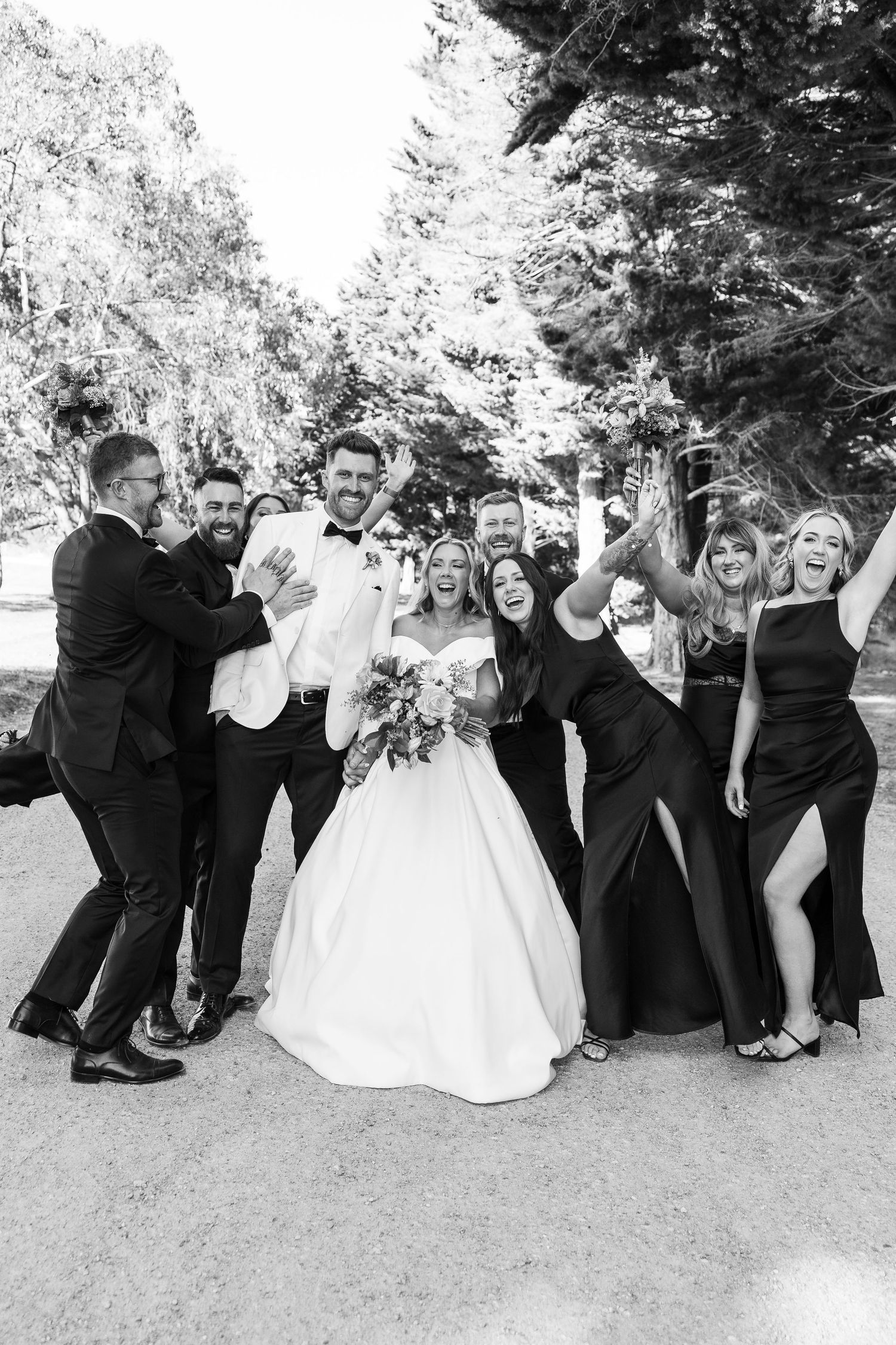 Wedding party / bridal party candid photos at Dromana Estate Winery in black tie. Fun Wedding Party Photos on the Mornington Peninsula