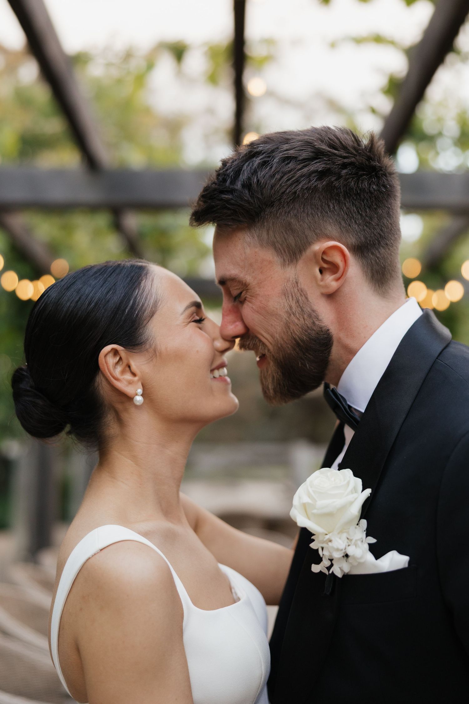 A romantic wedding couple shares intimate close-up moment at Merrick's Store Wedding