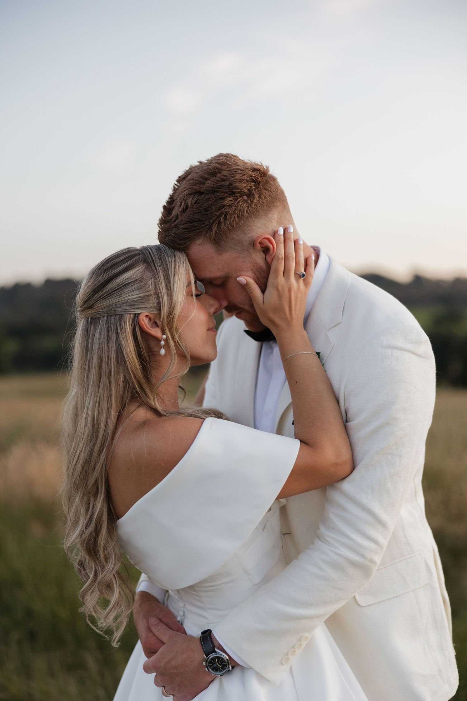 Bride & Groom share an intimate moment during golden hour portraits at sunset wedding photography session Dromana Estate Winery