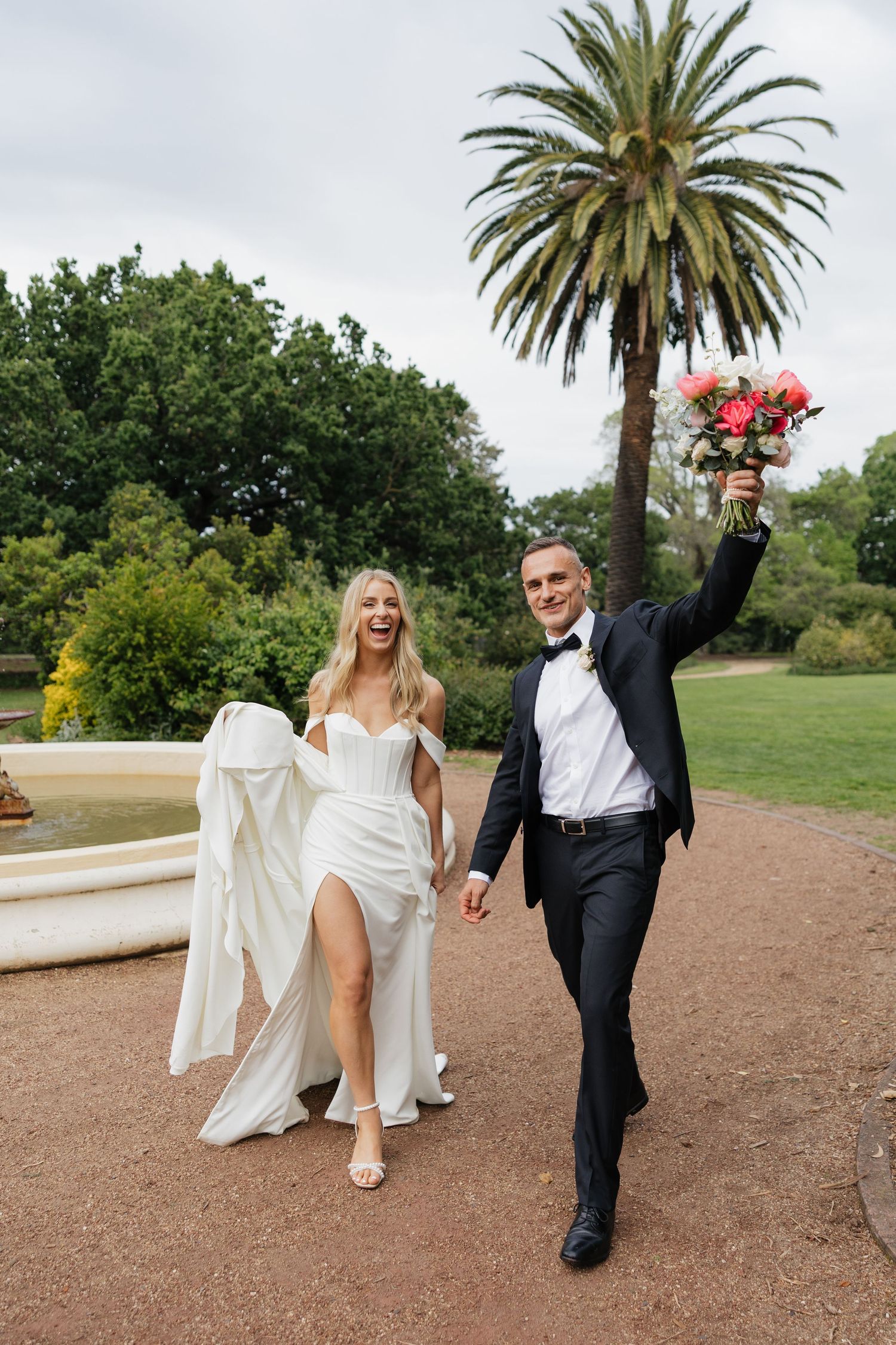 Candid Wedding Photography fun walking pose at Brighton Gardens followed by a reception at Baths Middle Brighton