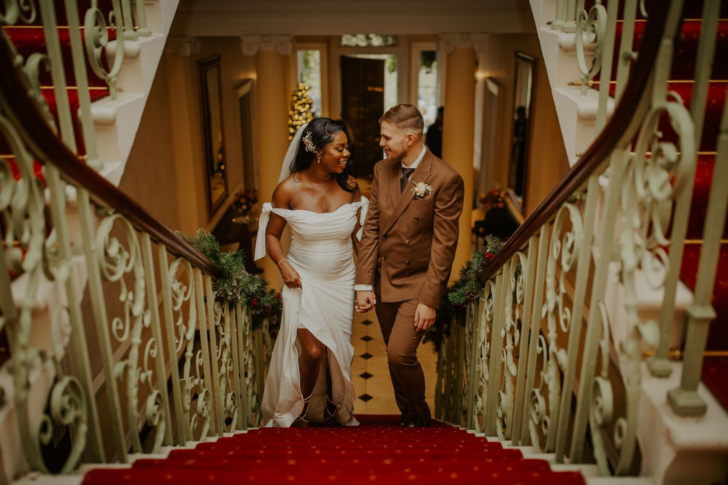 Bride and Groom after their wedding ceremony on the staircase at Morden Park House - London - RELM Photography