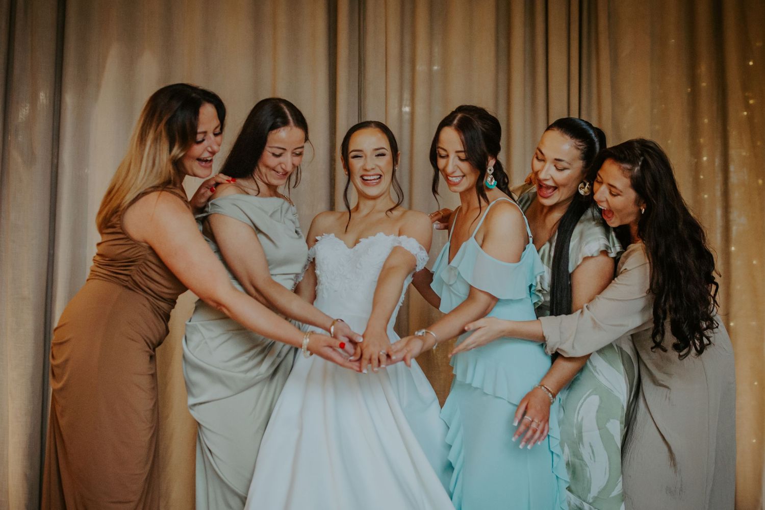 Bride with all her sisters at her wedding venue Lapstone Barn – Chipping Campden, The Cotswolds
