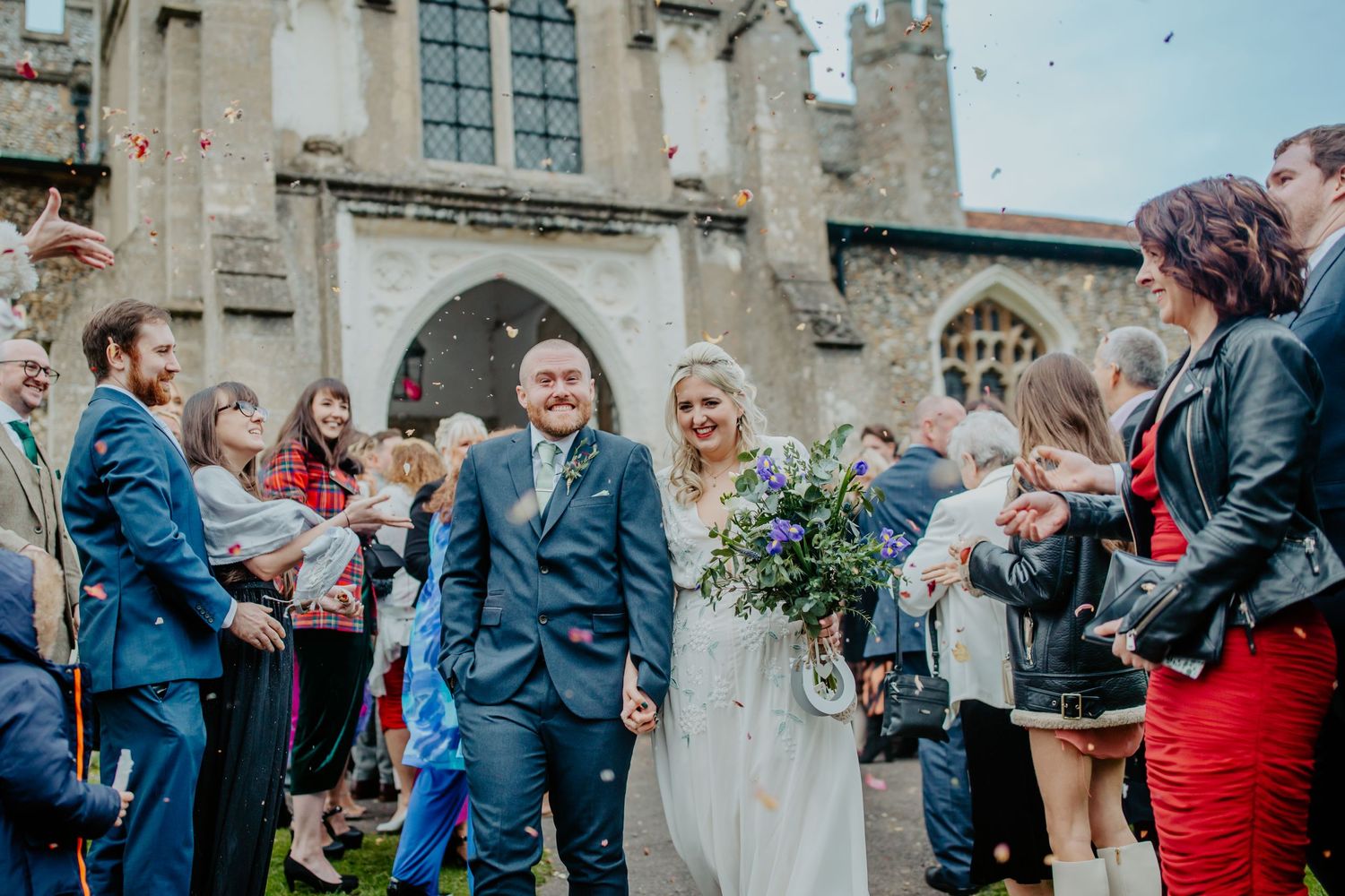Bride and groom confetti walk outside St Mary The Virgin - Braughing Village Church Hertfordshire, RELM Photography