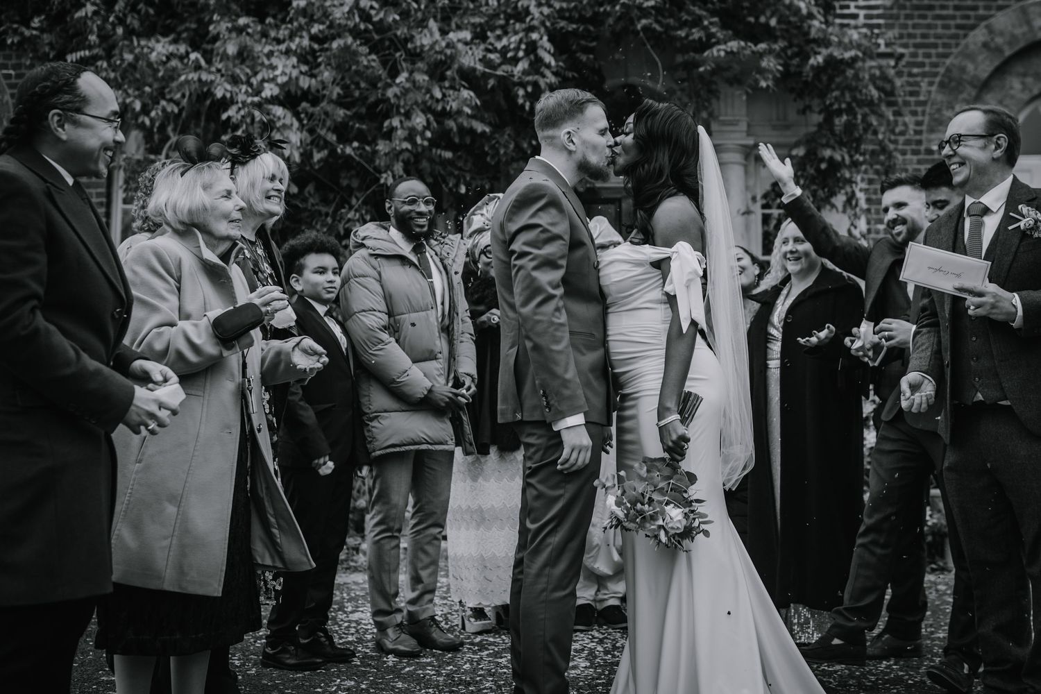 Bride and Groom doing a confetti kiss outside Morden Park House - London - RELM Photography