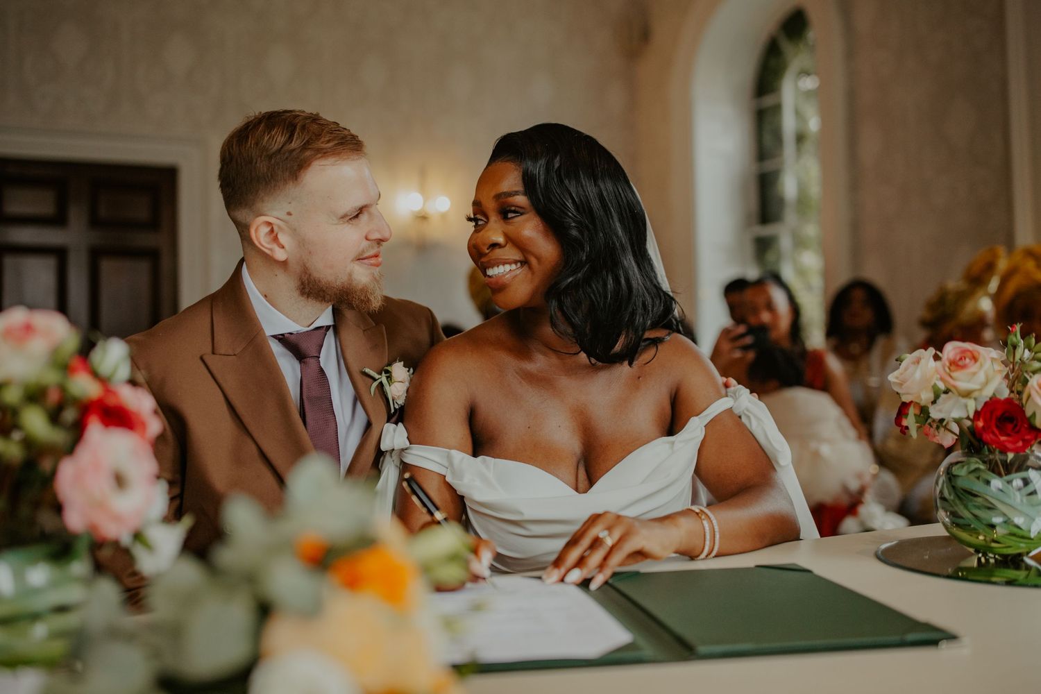 Bride and Groom looking lovingly at each other at their wedding ceremony at Morden Park House - London - RELM Photography
