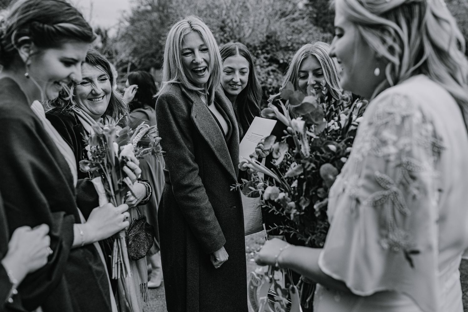 Bride showing off her wedding rings outside Braughing Church Hertfordshire, Photographer RELM Photography