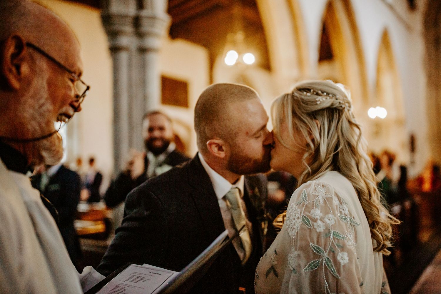 Bride and Groom share first kiss at Braughing Church, Hertfordshire – RELM Photography.